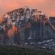 The North Face of Mount Kailash glowing gold at sunset.