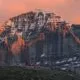 The North Face of Mount Kailash glowing gold at sunset.