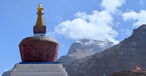 Yamadwar stupa with the snow-draped South Face of Kailash rising behind it.